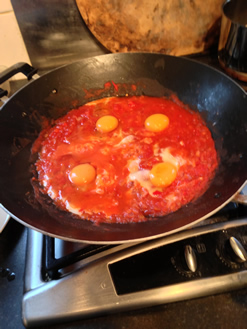 Shakshuka - Add the eggs to the tomato sauce